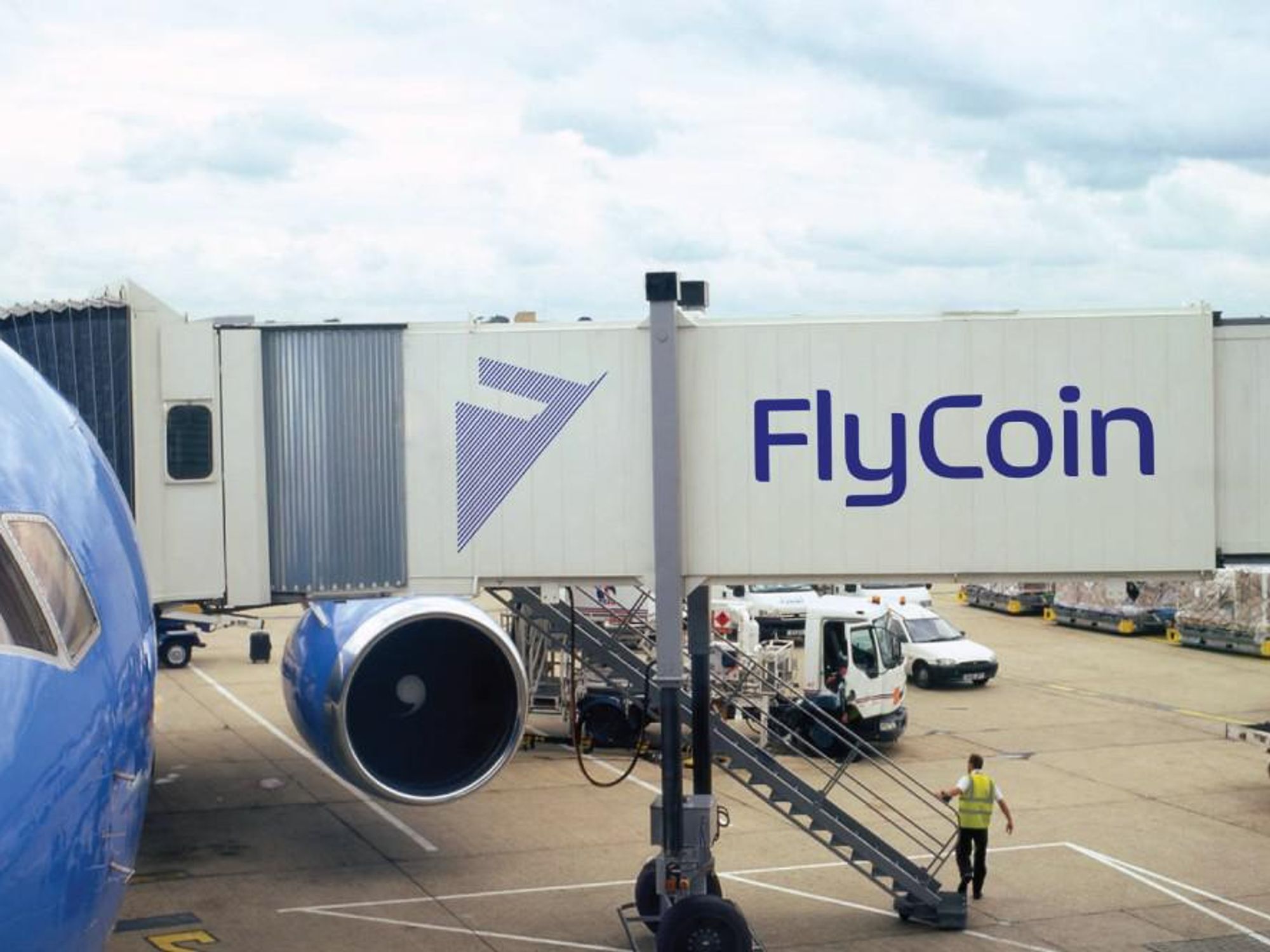 A FlyCoin ad on an airline passageway.