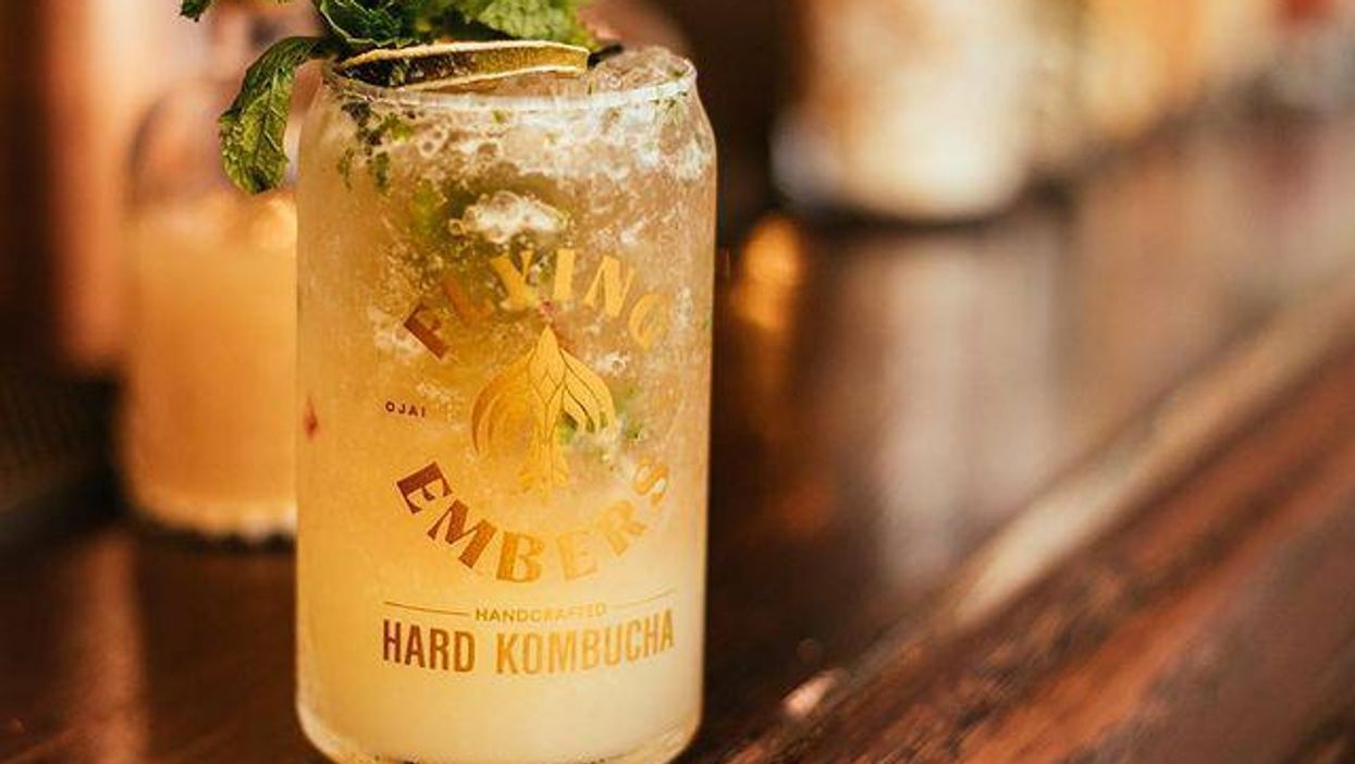 A glass of Flying Embers hard kombucha.