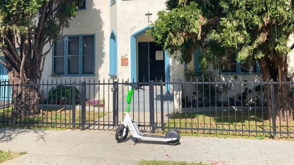 A Lime e-scooter parked in West Adams.