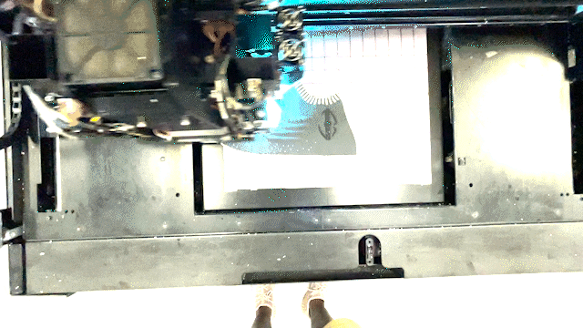 A machine digitally making a shoe 