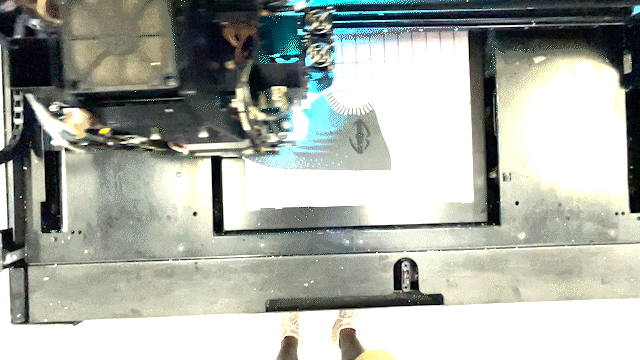 A machine digitally making a shoe