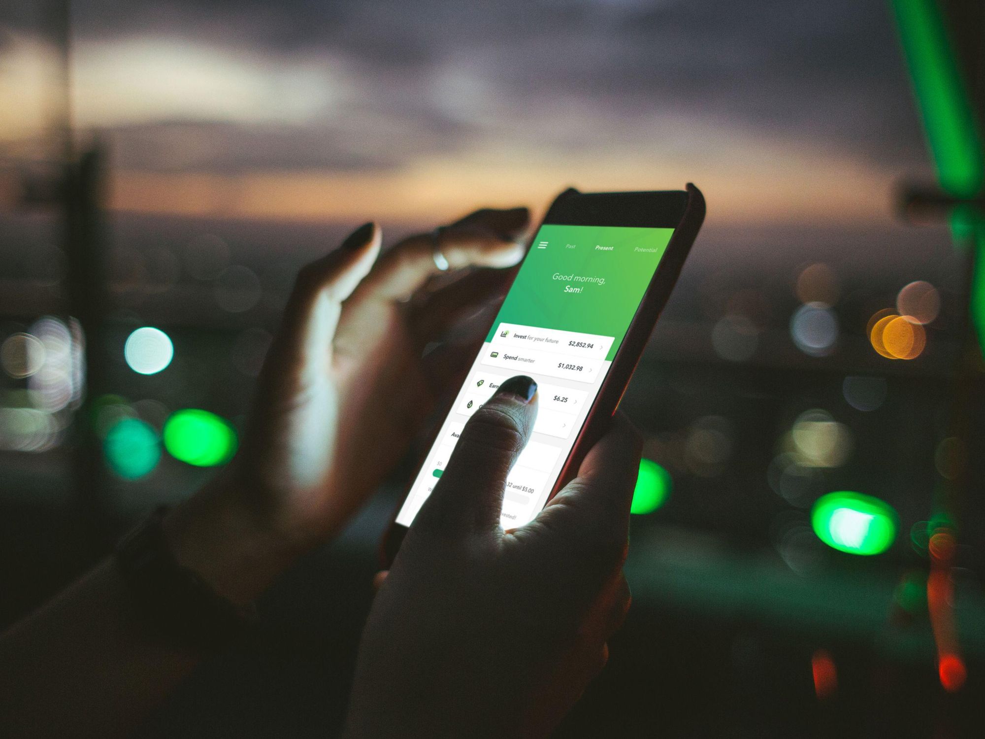 A person using the Acorns fintech app.