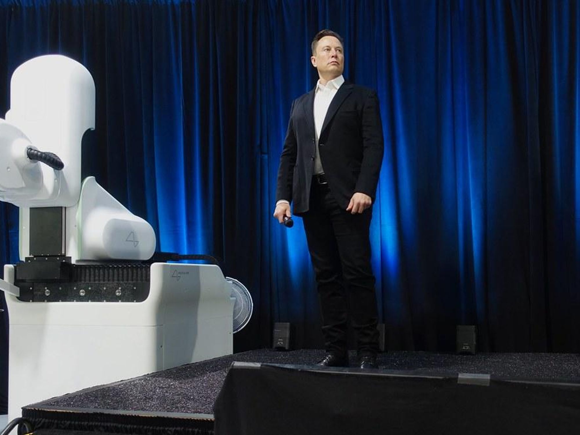 Elon Musk standing in front of demonstration prototype