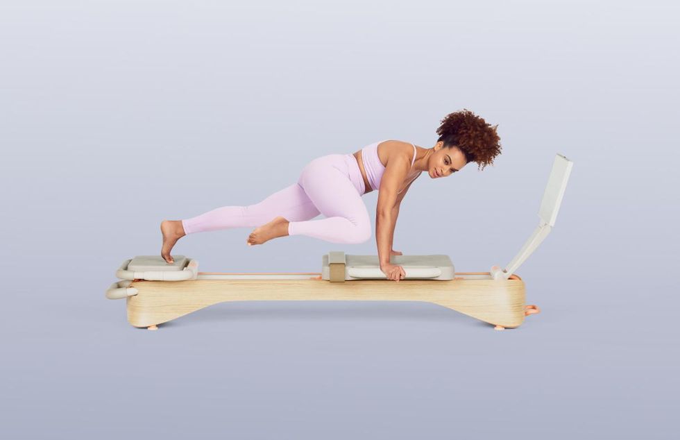 Frame Fitness reformer in use.