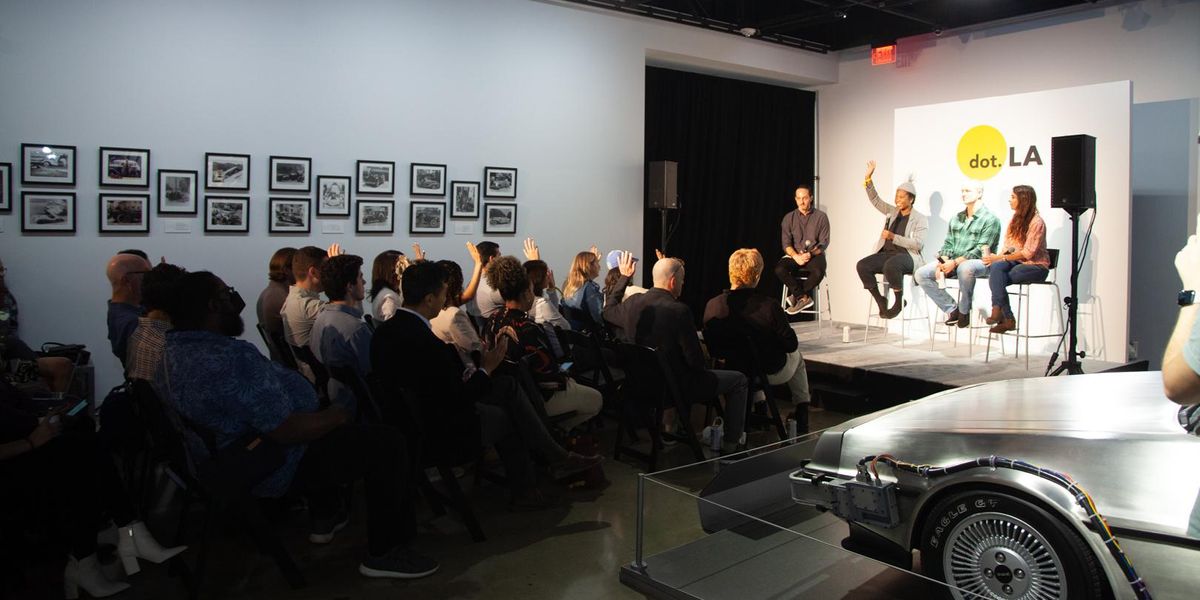 guests raise their hand and participate in Summit panel