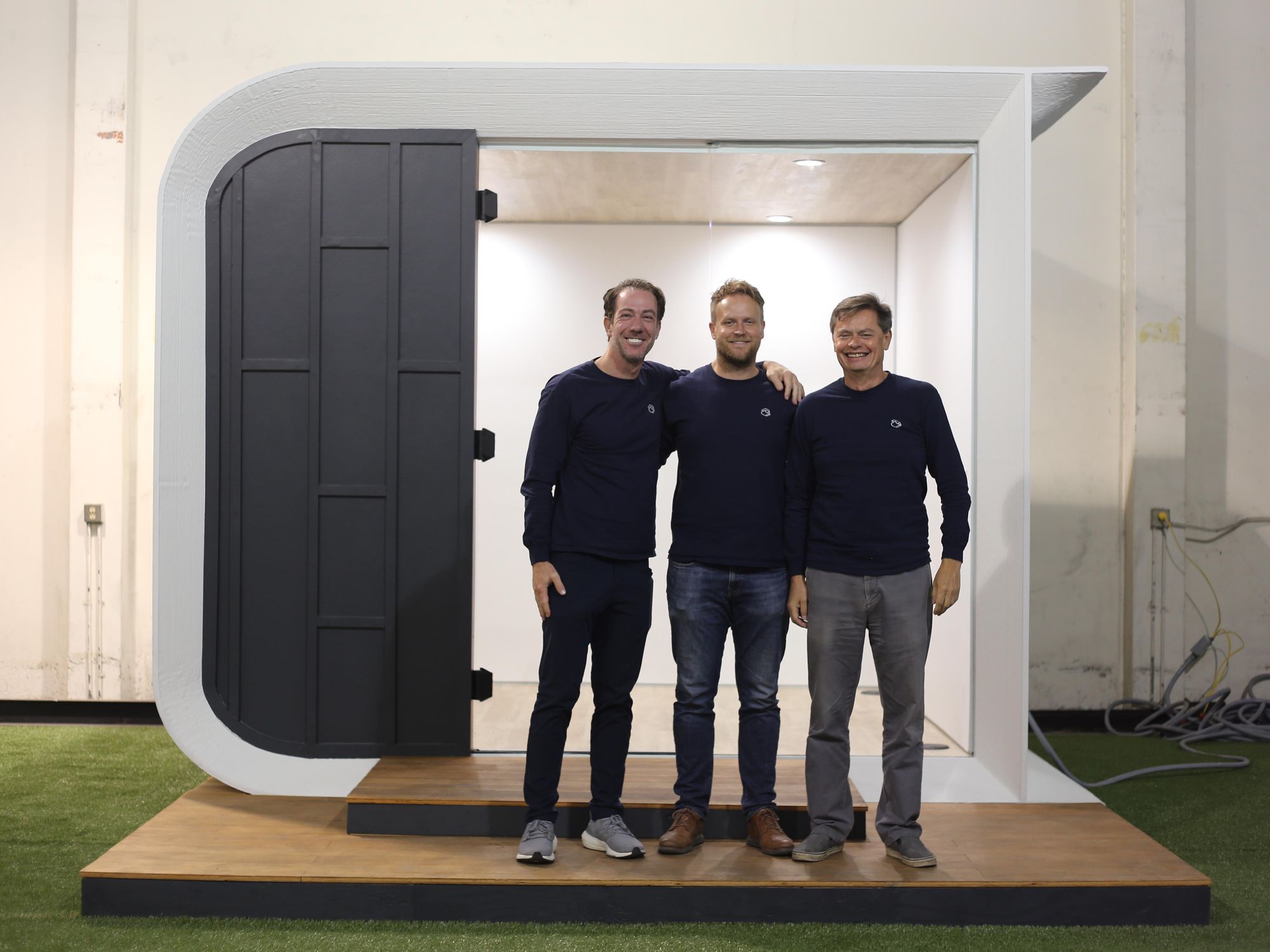 https://dot.la/media-library/head-of-growth-ron-barnoy-ceo-ross-maguire-and-gene-eidelman-stand-in-front-of-the-first-azure-3d-printed-studio.jpg?id=29905386&width=2000&height=1500&quality=85&coordinates=307%2C0%2C301%2C0