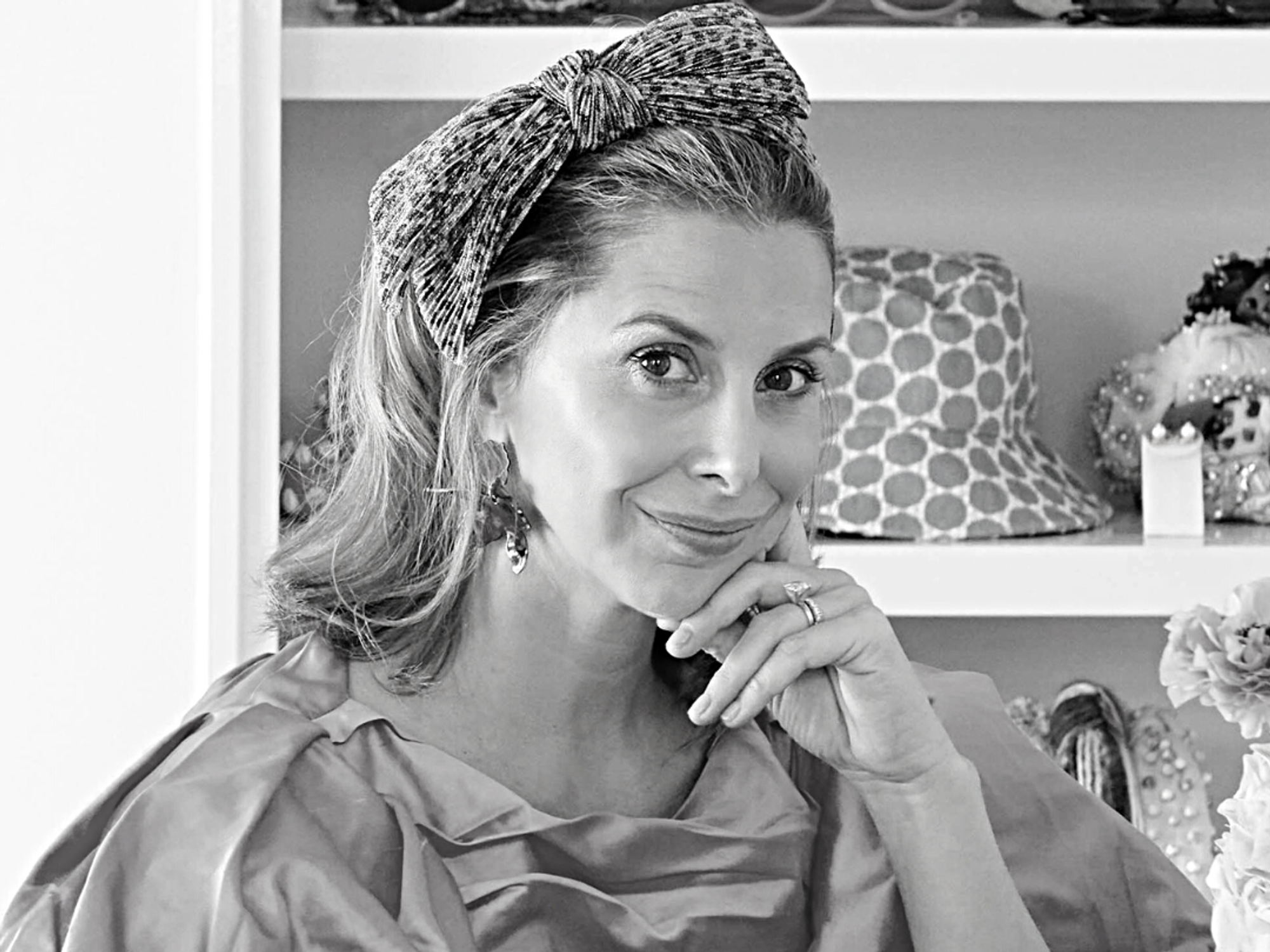 Lele Sadoughi in black and white with a headband