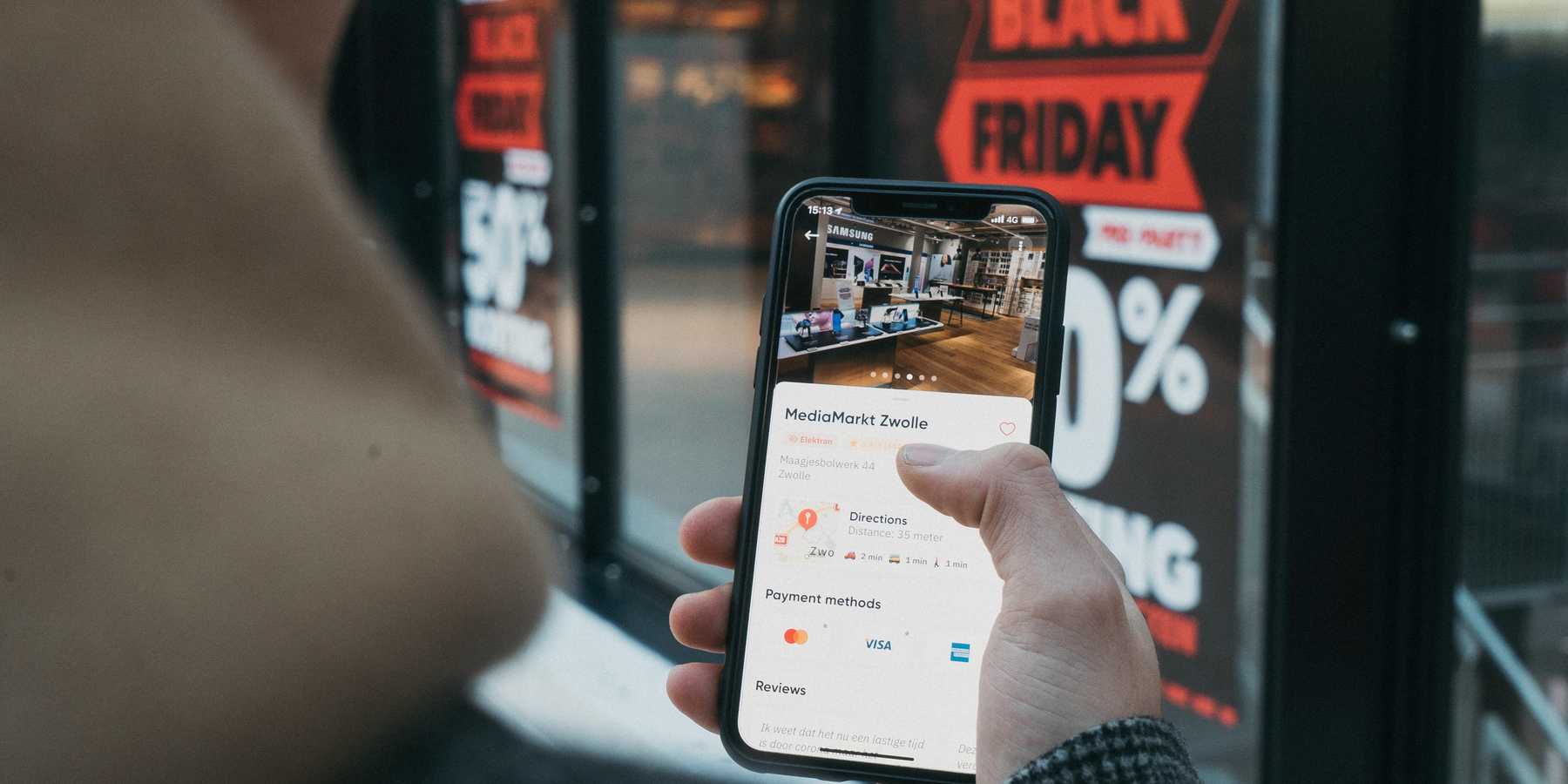 person holding a phone on Black Friday