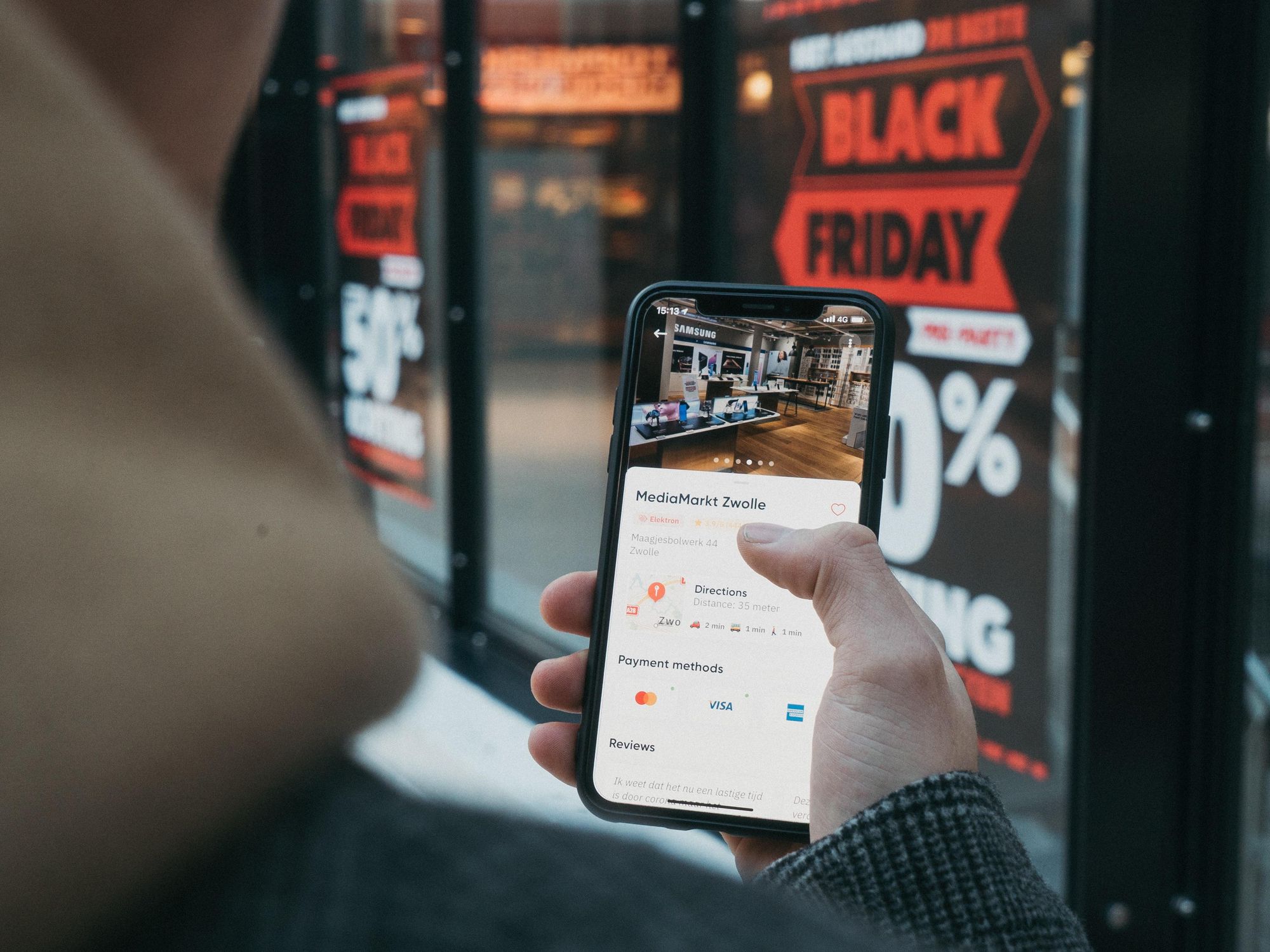 person holding a phone on Black Friday