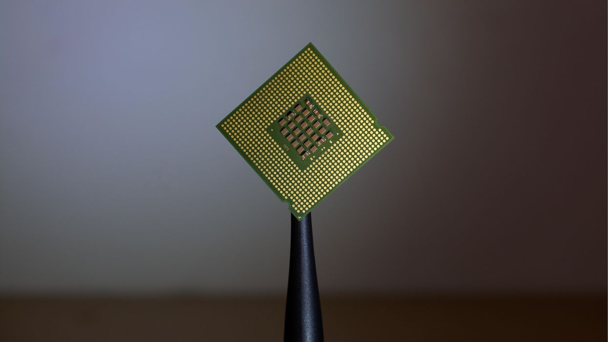 person holding computer cell processor