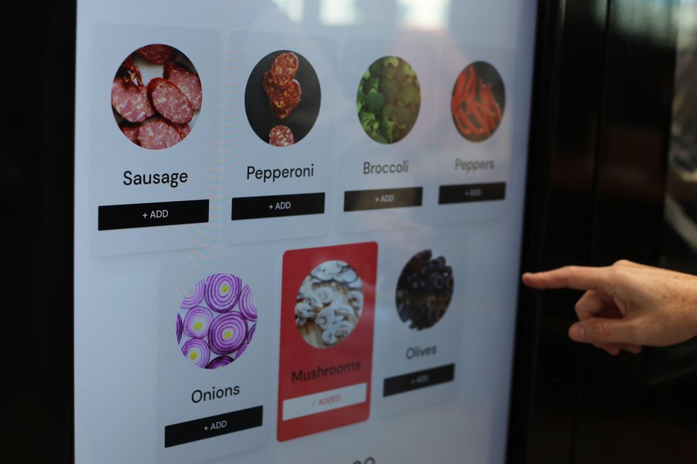 Piestro customers can pick the toppings on their pizza with the touch of a screen.