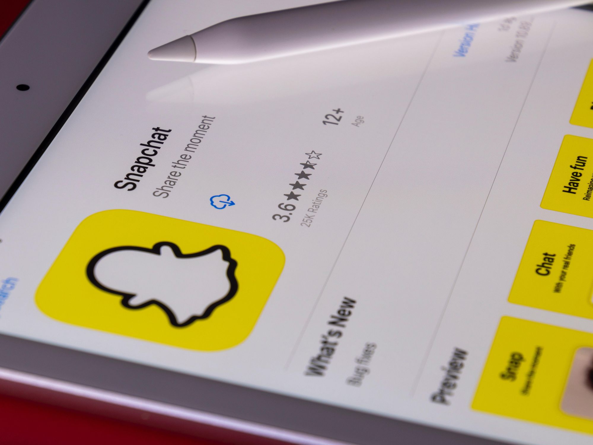 Snapchat on the app store on iPad with Apple Pen resting on iPad.