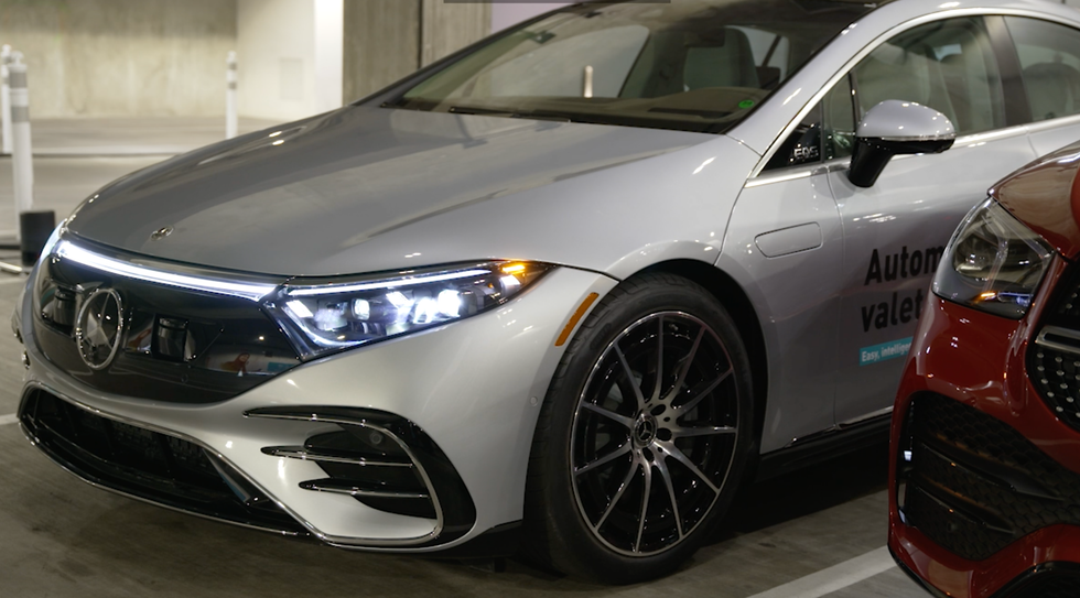 The vehicle pulls out from its parking spot and drives itself to its owner.