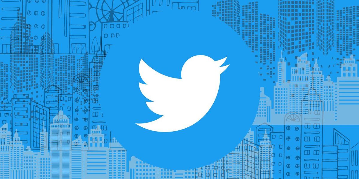 Twitter logo in busy city scape 