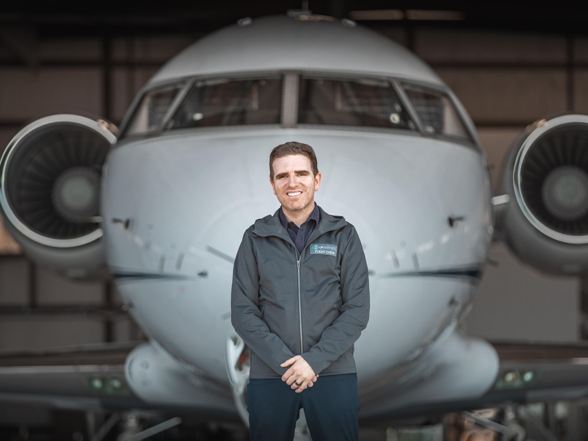 UP Partners’ Ben Marcus stands in front of a airplane.​